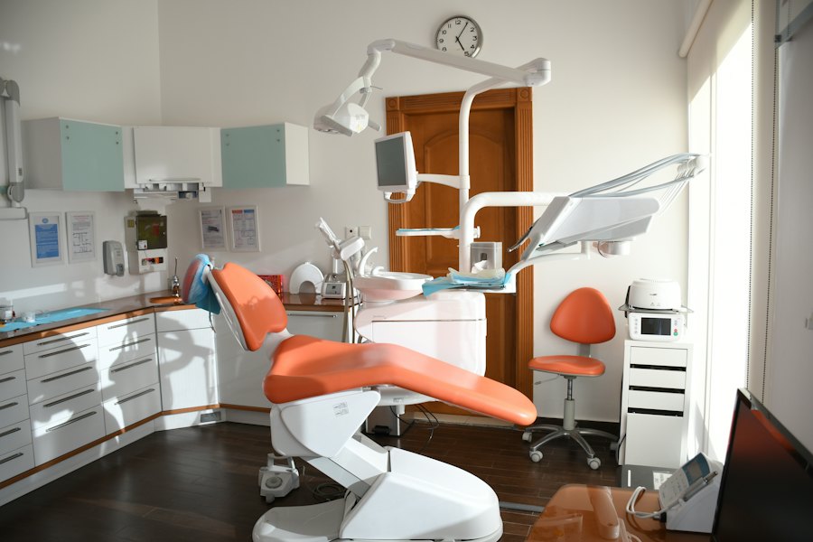 A bright treatment room with a dental chair